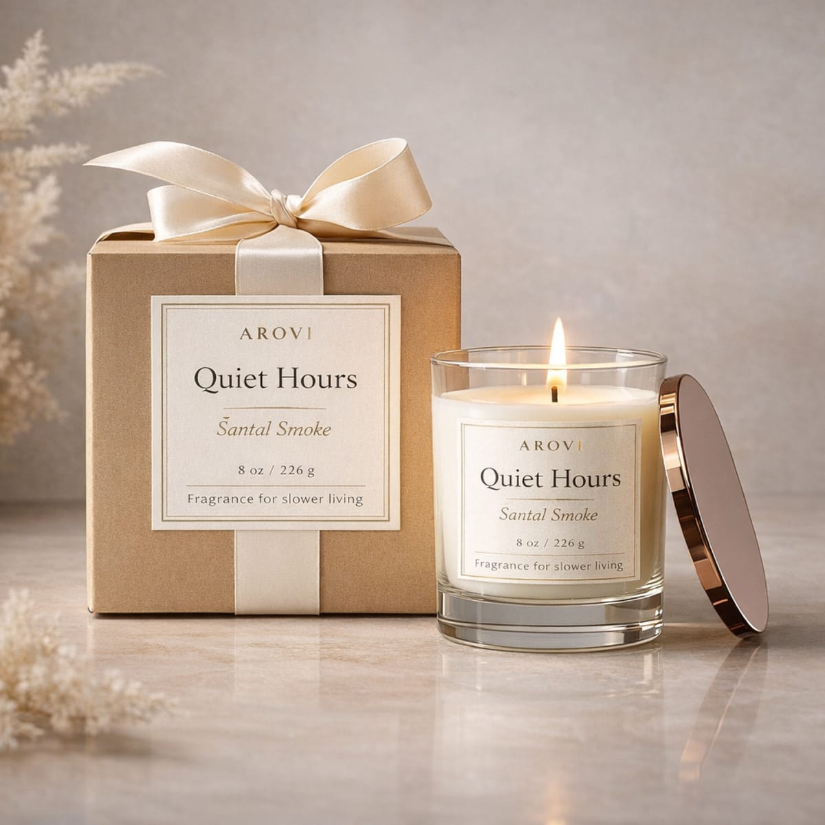 Clear glass candle with metallic lid and ribbon gift box