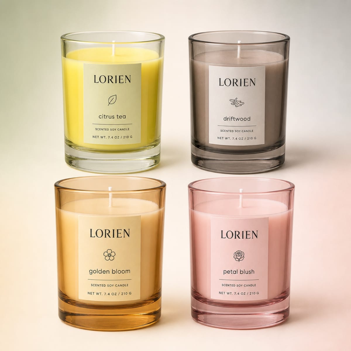 Four colored glass candles in yellow, smoke, amber and pink