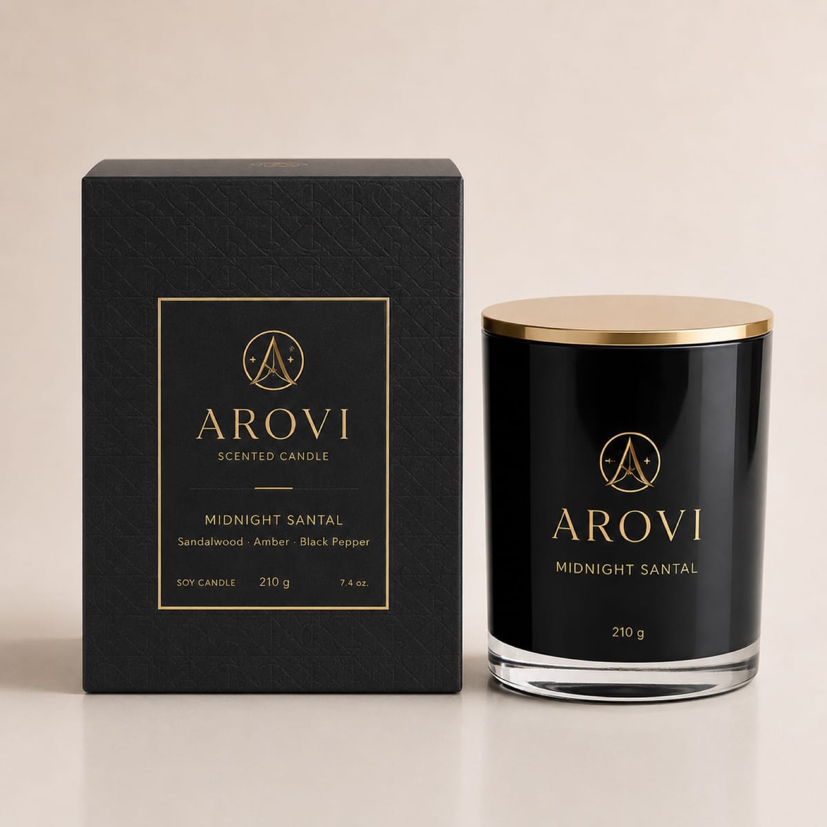 Black glass candle with gold lid and matching carton