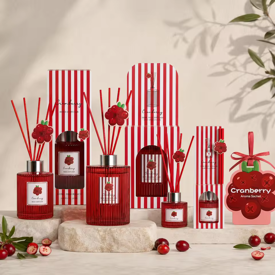 Cranberry home-fragrance collection with 50ml, 150ml and 200ml reed diffusers, scented-paper air freshener, and coordinated packaging