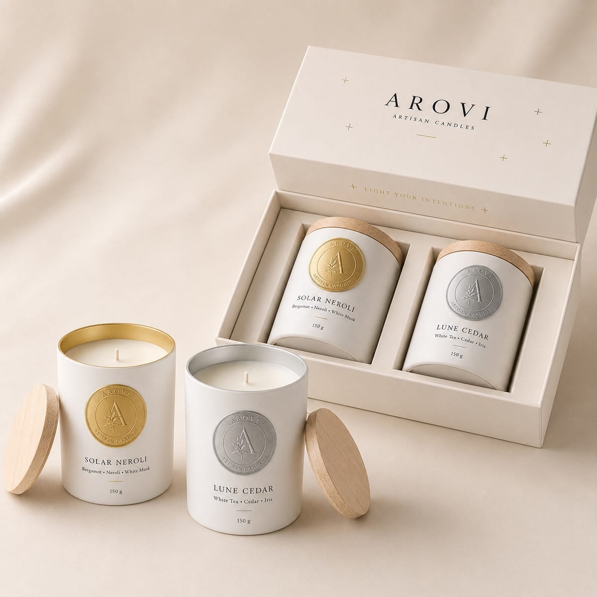 Gold and silver two-candle gift set with coordinated wood lids and presentation box