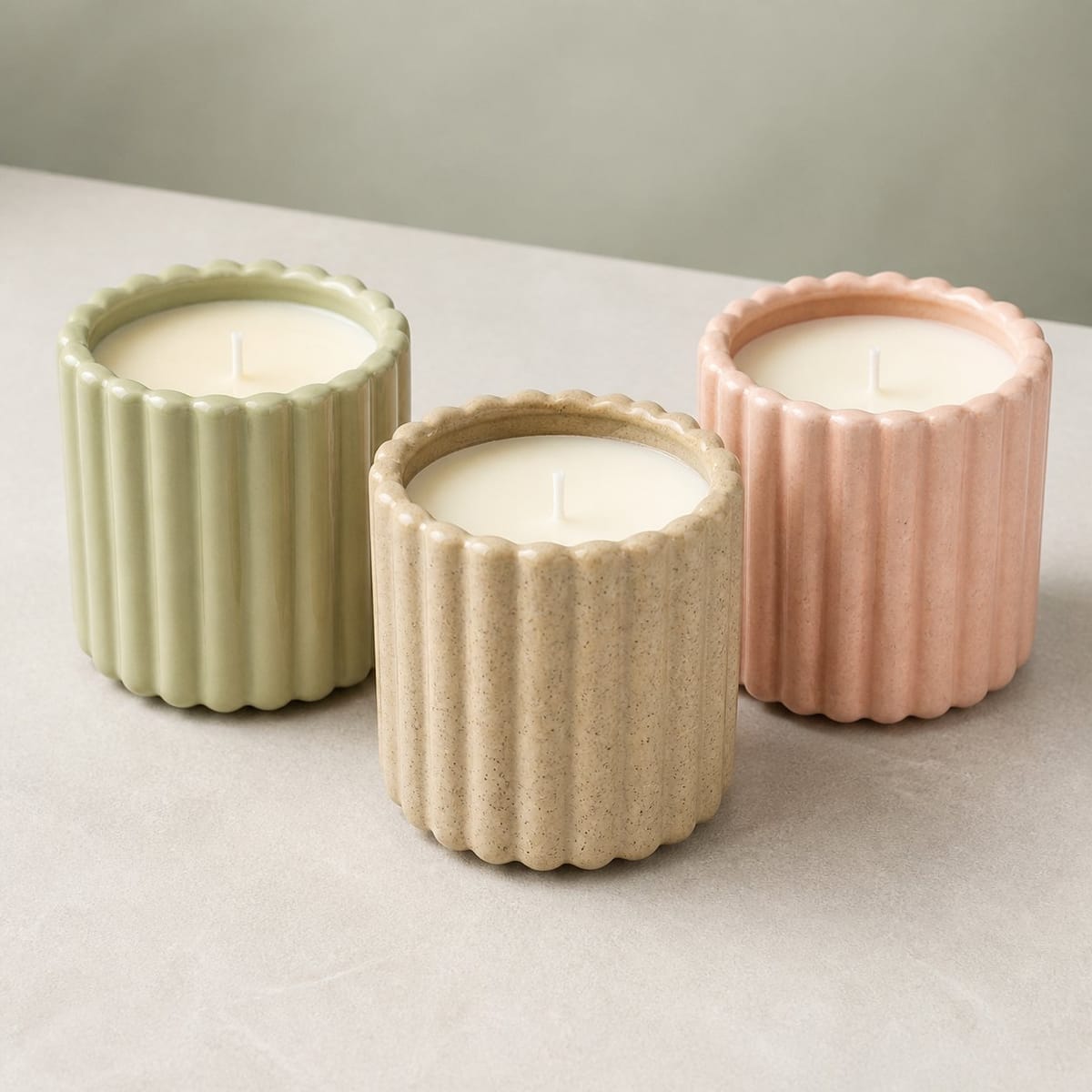Pale green, tan, and blush fluted ceramic candles