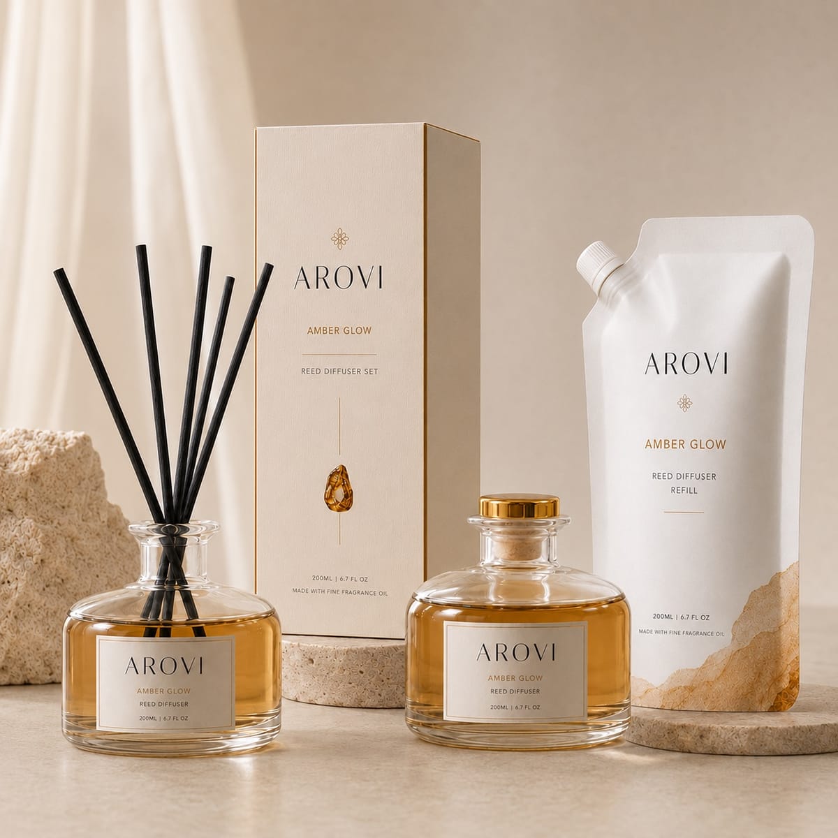 Round-base amber reed diffuser with black reeds, 200ml refill pouch, and coordinated box