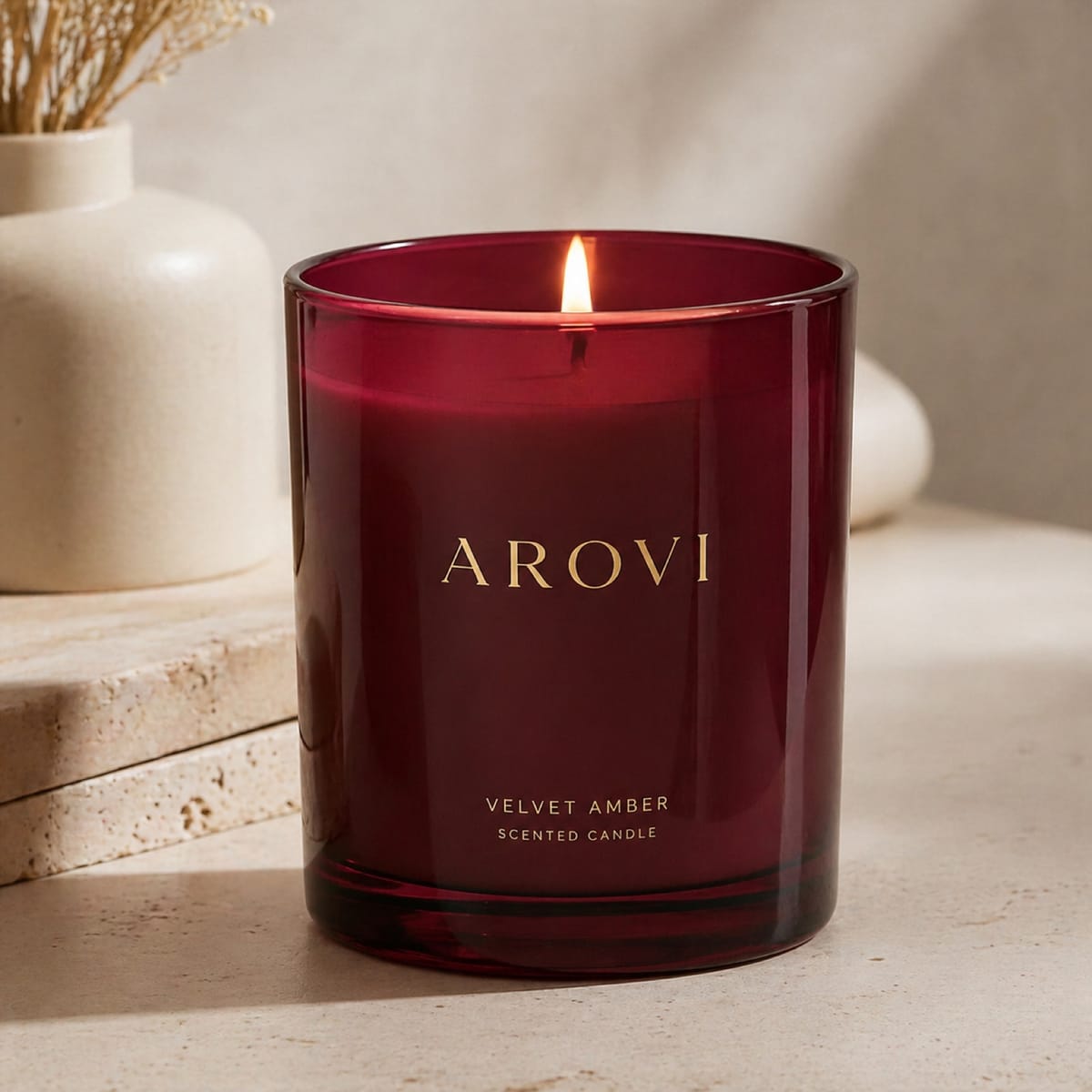 Lit candle in a deep ruby glass vessel